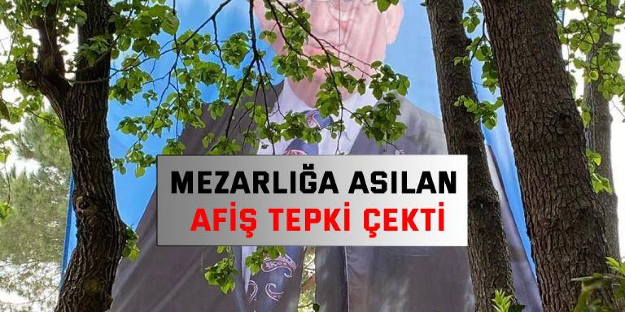 Mezarlığa asılan afiş tepki çekti