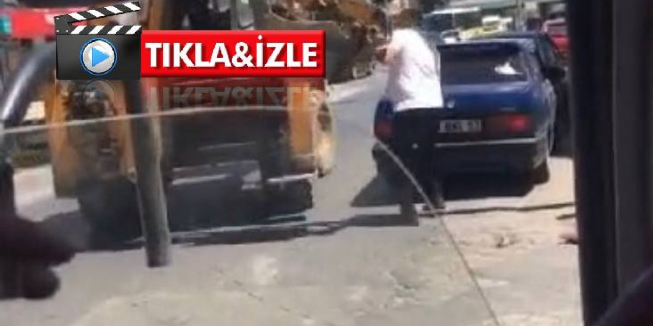 Tartıştığı sürücüye kepçe ile vurmaya çalıştı