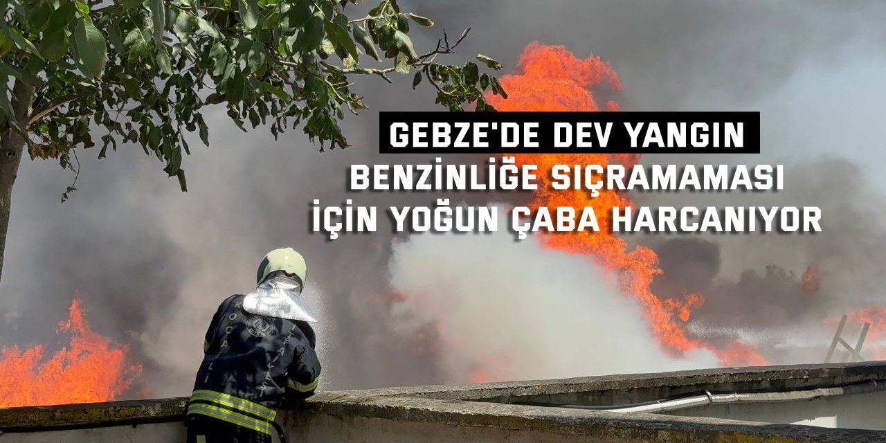 Alevlerin benzinliğe sıçramaması için itfaiye ekipleri yoğun çaba harcıyor