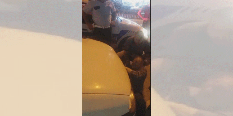 Esnaf, el konulan aracının altına yattı