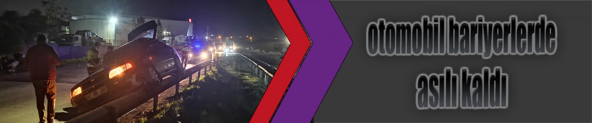 Otomobil bariyerlerde asılı kaldı